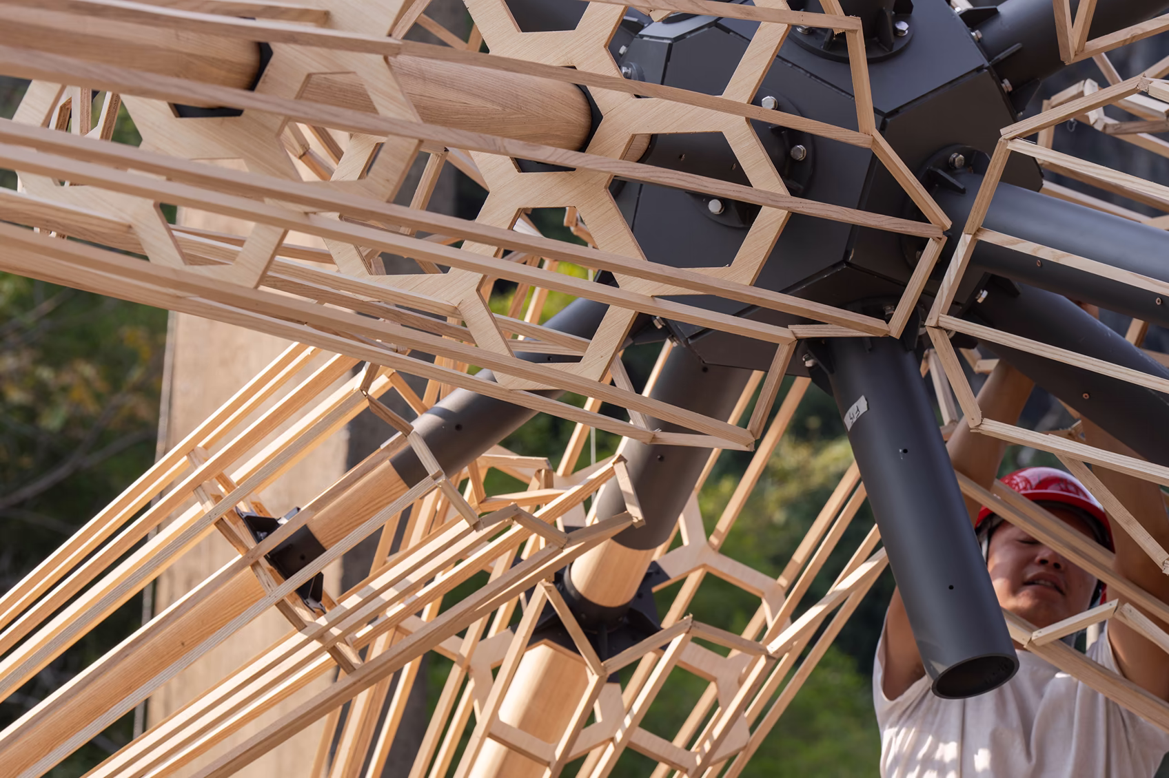 Workers assembling the "Super Star" burning installation on site