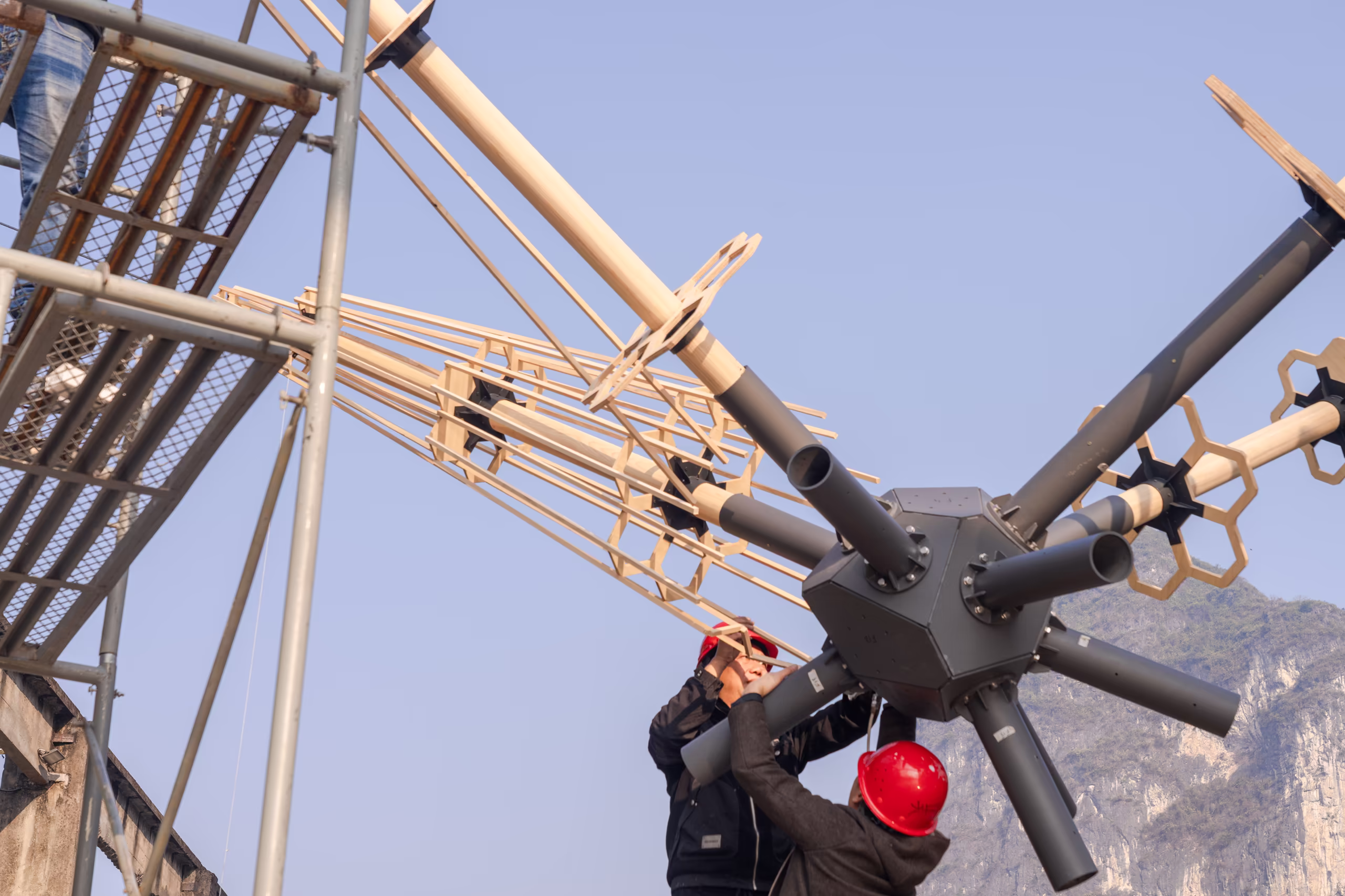 Workers assembling the "Super Star" burning installation on site